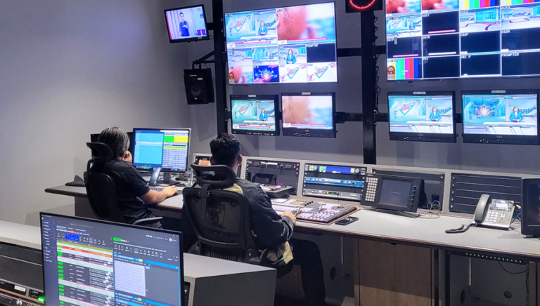 two people working in a broadcast control room