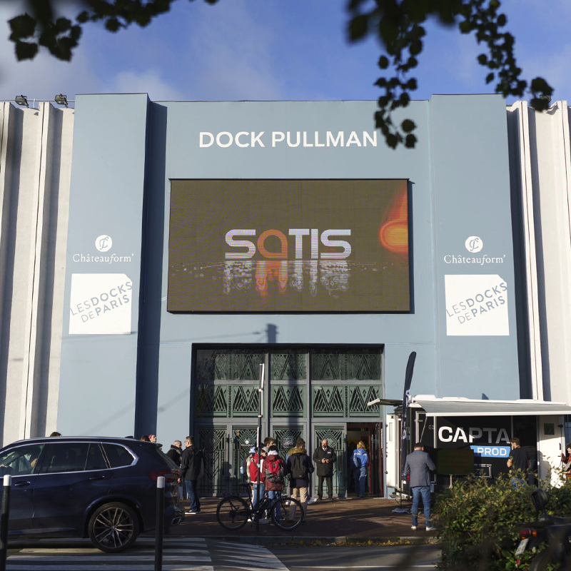 SATIS Expo logo on a sign outside of the Docks Pullman event building
