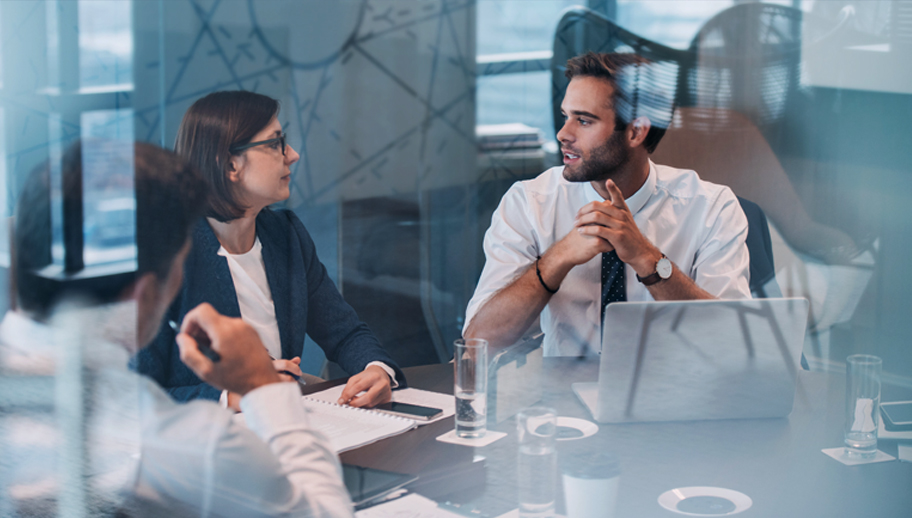 executives discussing options in a modern boardroom