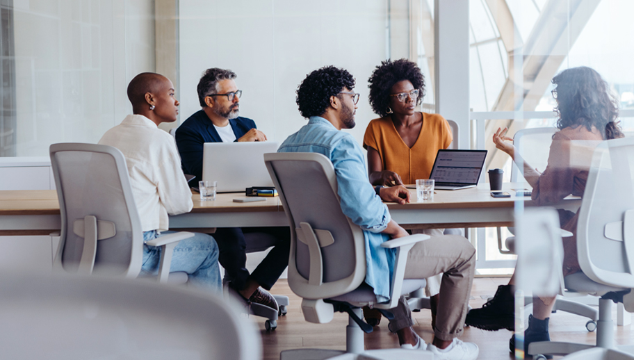group of professional discussing ideas at a meeting table